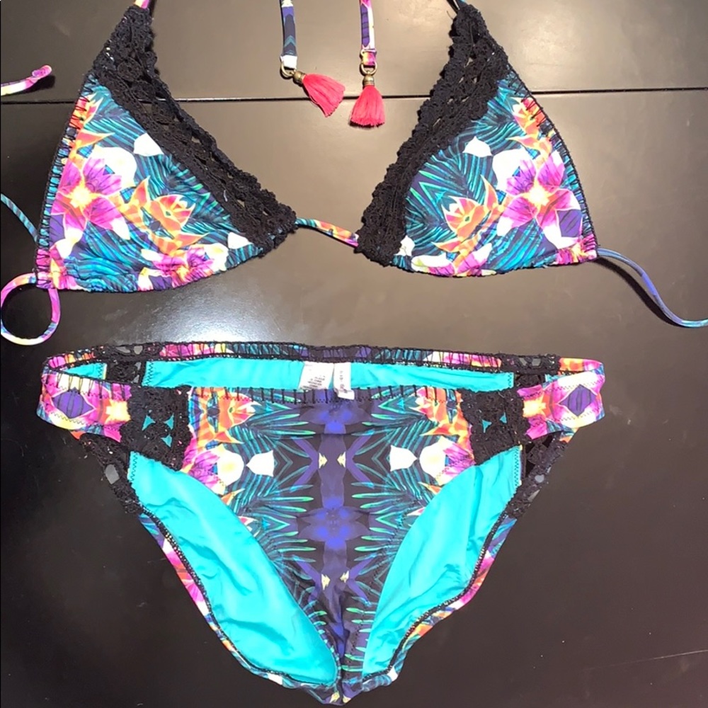 Never been worn.  Nannette Lepore jungle bikini